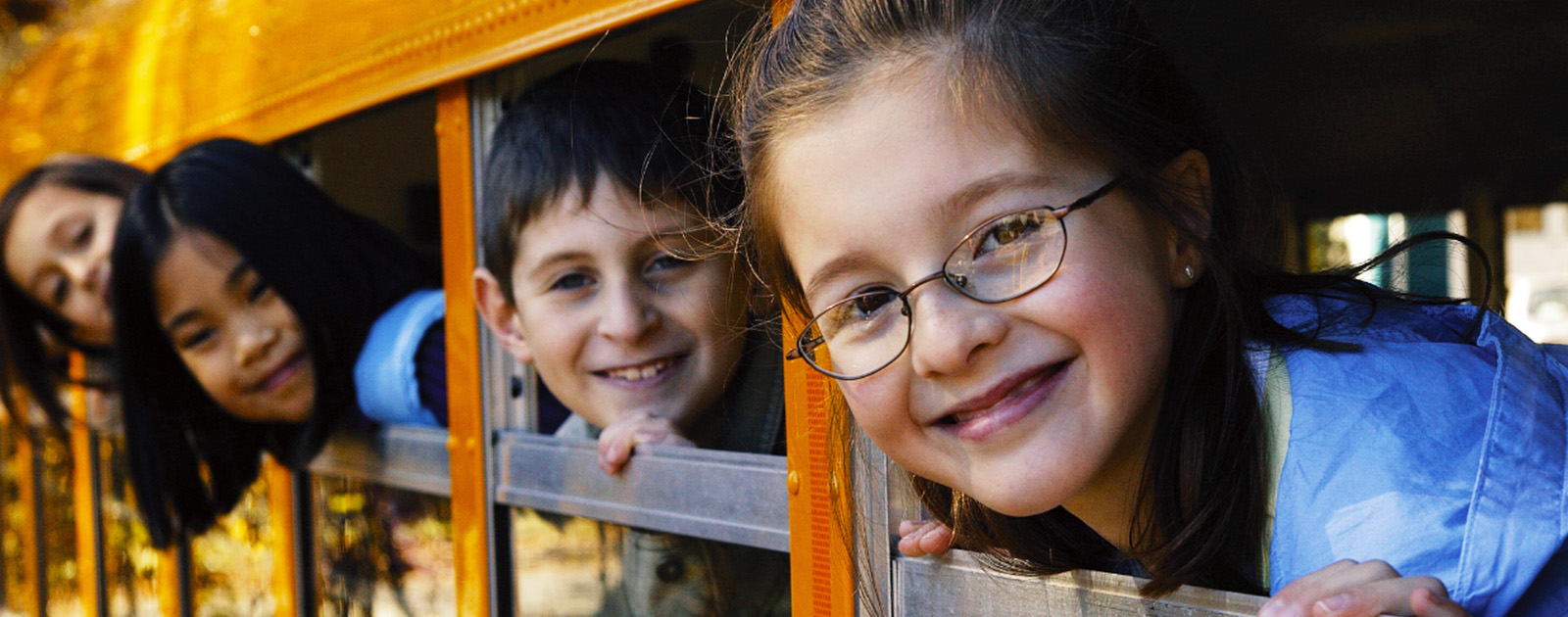 a group of kids on a school bus