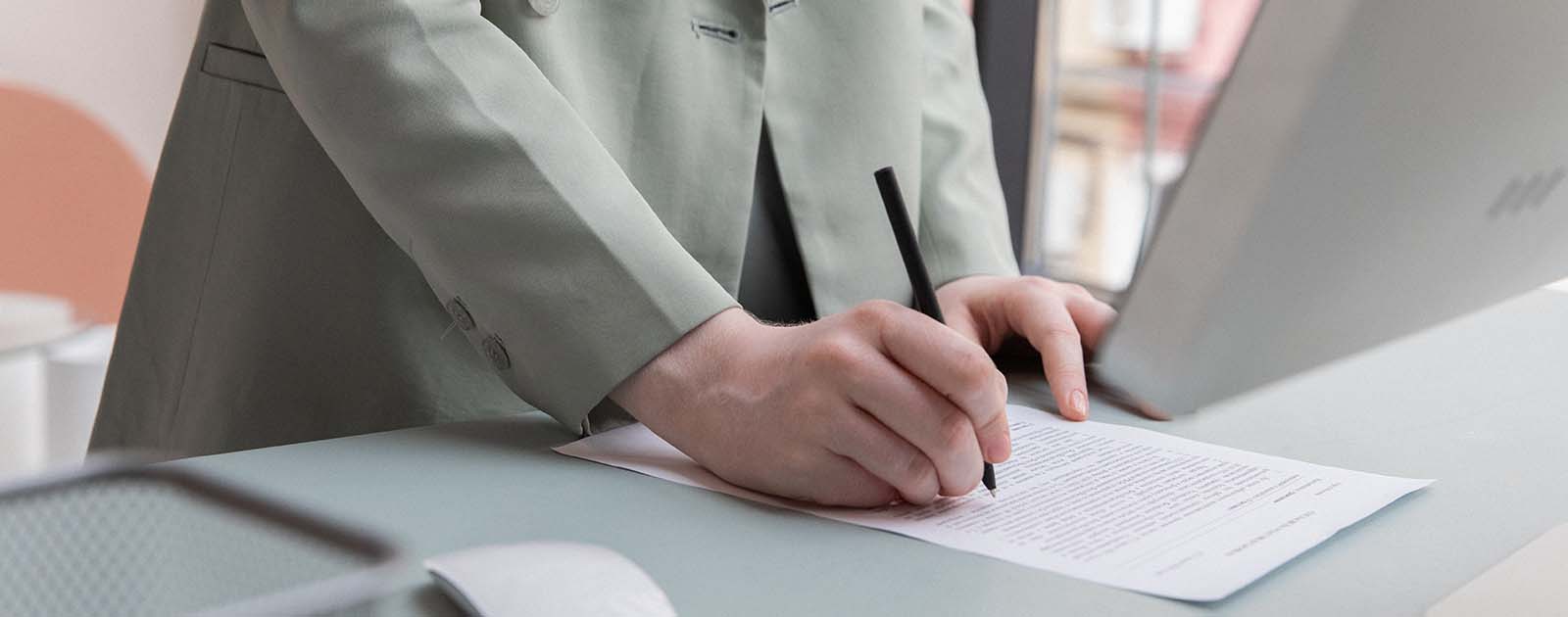 person writing a report