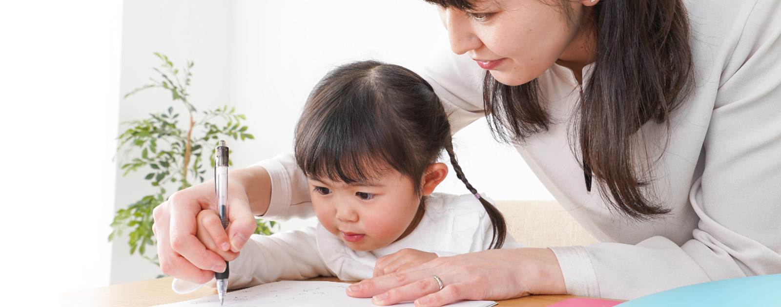 A teacher and a kid studying